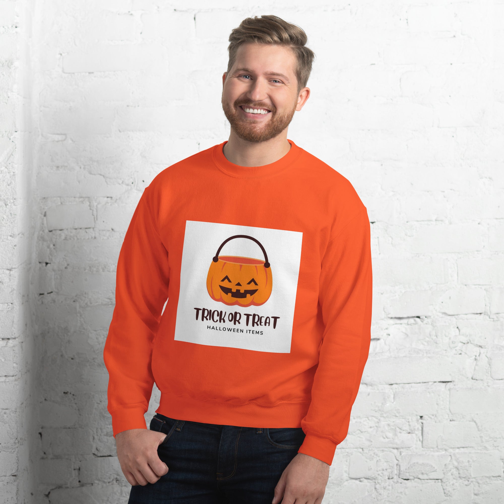Unisex sweatshirt for winter in bright orange with 'Trick or Treat' Halloween design, perfect for festive attire.
