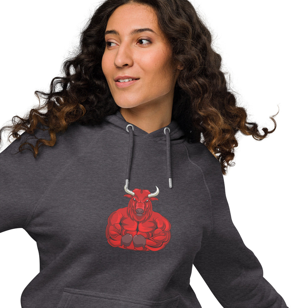 Unisex eco raglan hoodie featuring red bull graphic on a model with curly hair, showcasing a relaxed fit.