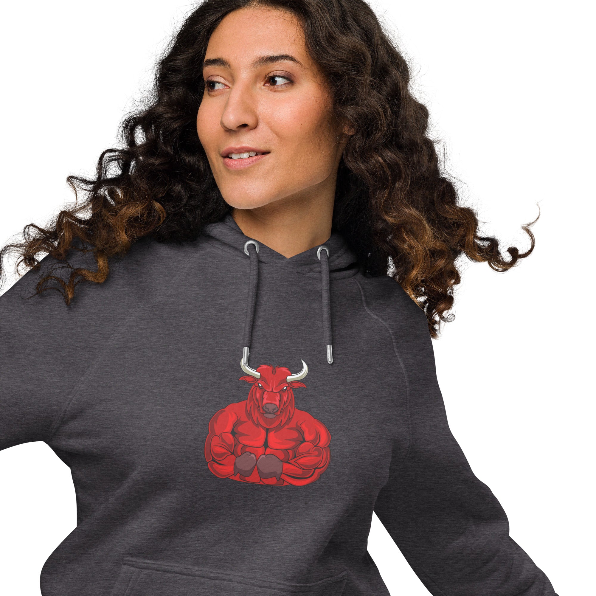 Unisex eco raglan hoodie featuring red bull graphic on a model with curly hair, showcasing a relaxed fit.